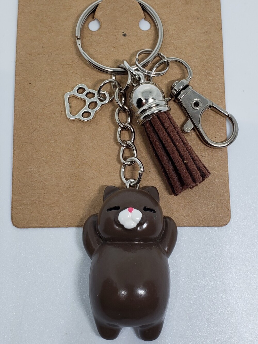Handmade painted resin white dark brown cat paw keychain